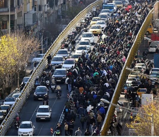 Iranian protesters clash with security forces as tear gas fills Tehran streets amid nationwide unrest